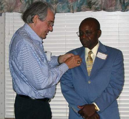 Neal Naranjo pinning Medal on Joe Deason